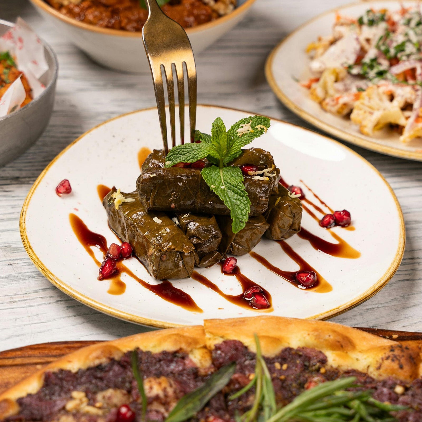 Stuffed Grape Leaves with Pomegranate Glaze
