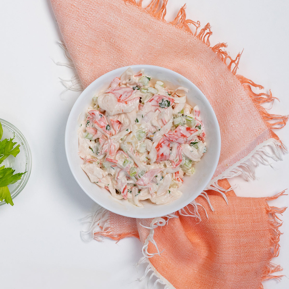 Krab Salad with imitation crab, celery and creamy dressing in a white bowl by Zina's Fine Foods