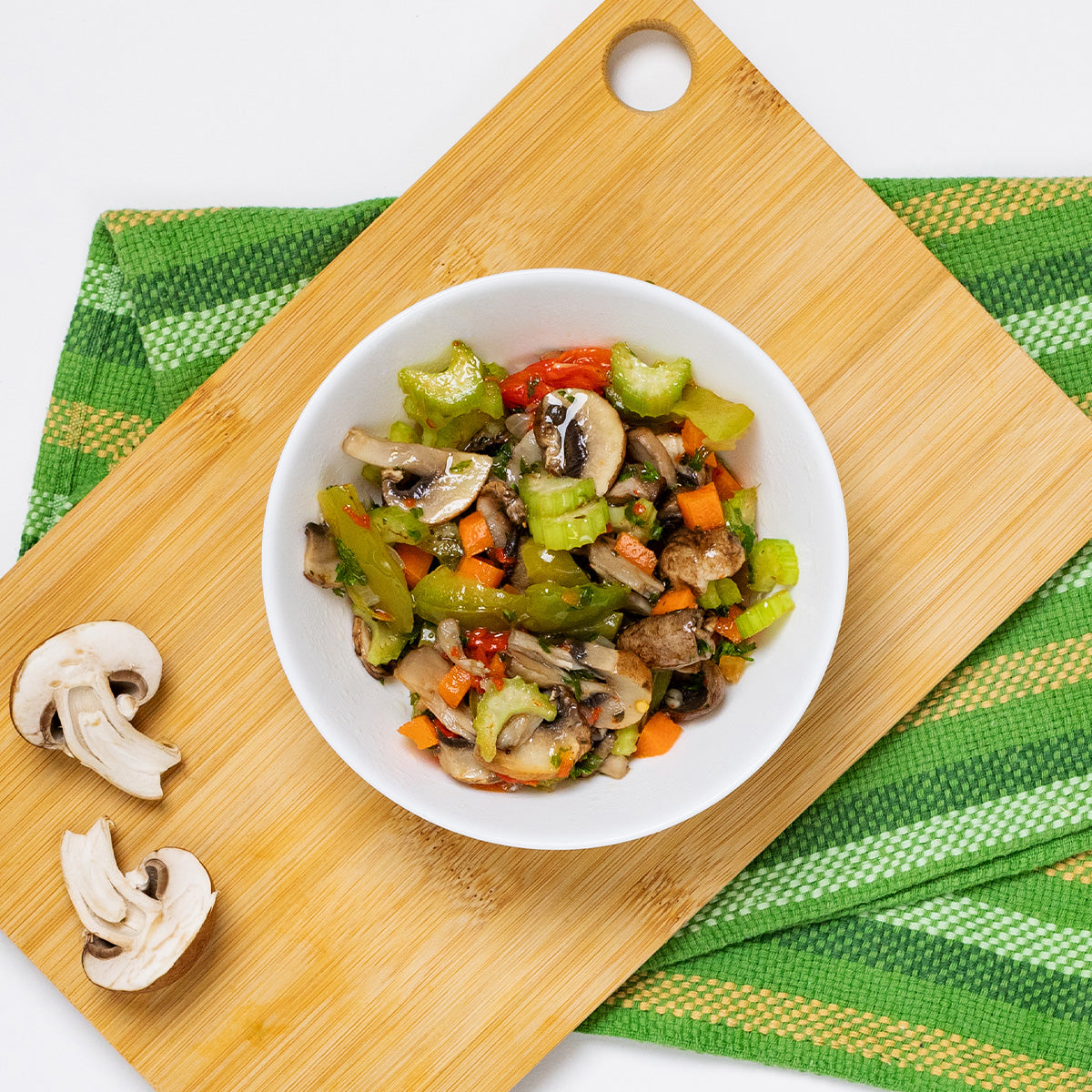 Portobello Mushroom Salad with mushrooms, celery, peppers and carrots in a white bowl by Zina's Fine Foods